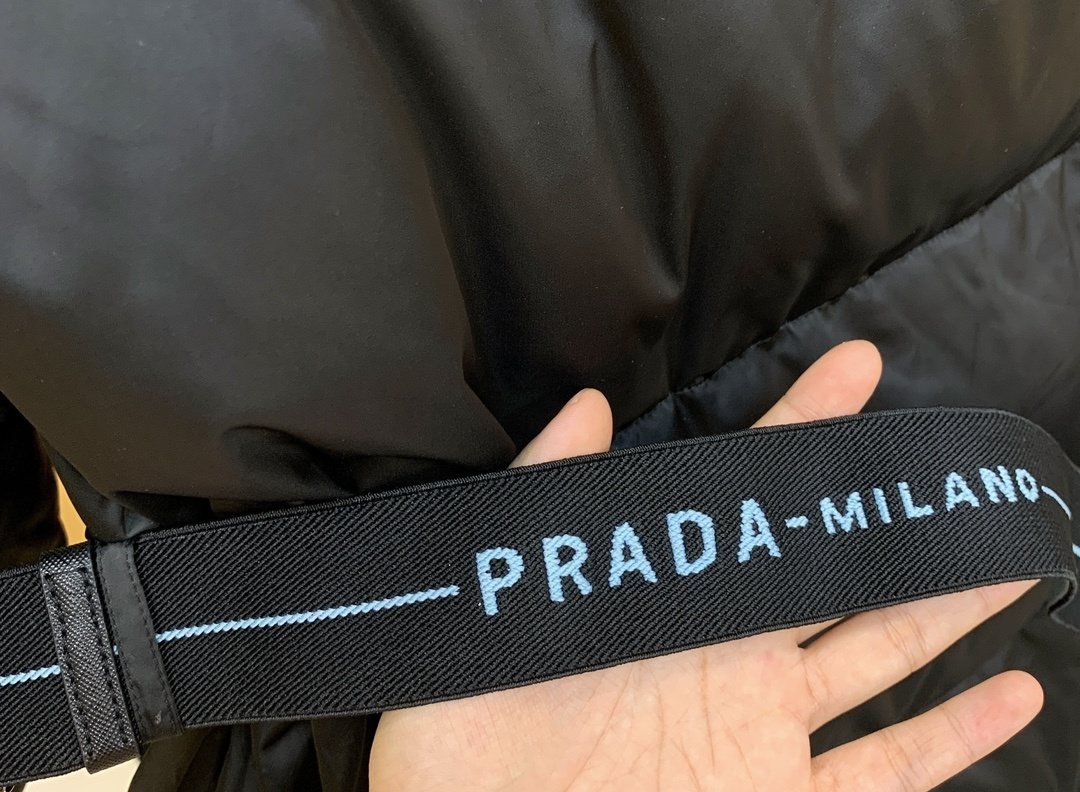 Prada Long Belted Puffer Jacket — detail