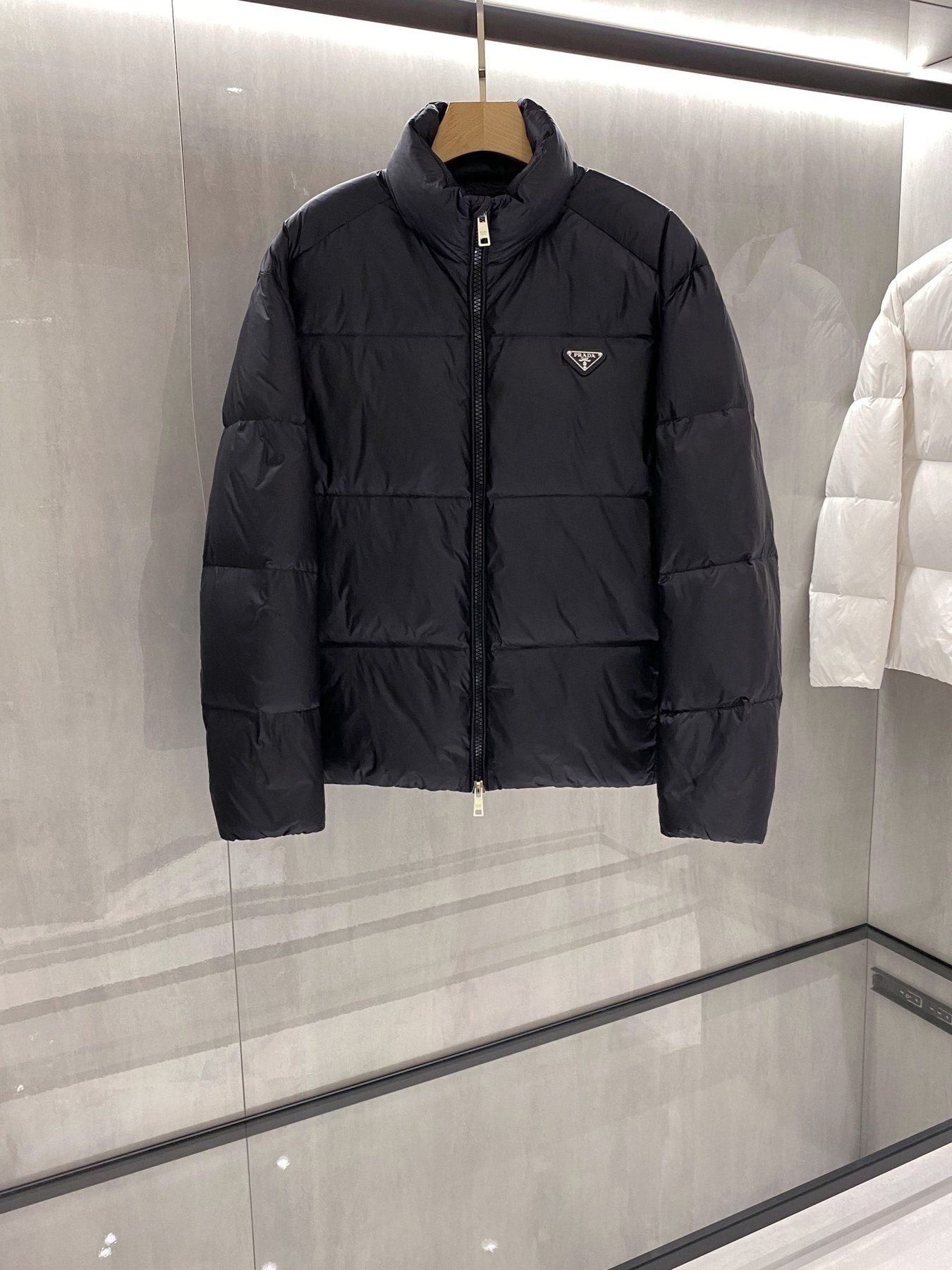 Prada Quilted Triangle Badge Puffer Jacket — front
